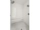 Modern tiled shower equipped with a built-in bench and dual showerheads at 23240 N Country Club Trl, Scottsdale, AZ 85255