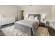Cozy bedroom with slate floors and a star patterned rug provides a comfortable retreat at 23240 N Country Club Trl, Scottsdale, AZ 85255