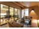 Cozy covered patio space that provides access to the indoor living areas of the home at 23240 N Country Club Trl, Scottsdale, AZ 85255