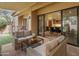 Cozy covered patio with outdoor seating that provides access to the indoor dining and living areas at 23240 N Country Club Trl, Scottsdale, AZ 85255