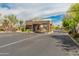 Gated community entrance with desert landscaping, offering security and privacy at 23240 N Country Club Trl, Scottsdale, AZ 85255
