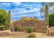 Pinnacle Peak Country Club Estates sign at the entrance, surrounded by desert landscaping at 23240 N Country Club Trl, Scottsdale, AZ 85255