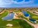Breathtaking aerial view of the golf course with water features and lush greenery at 23240 N Country Club Trl, Scottsdale, AZ 85255