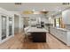 Spacious open kitchen features a large center island, stainless steel appliances and counter seating at 23240 N Country Club Trl, Scottsdale, AZ 85255