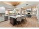 Beautiful open kitchen with a large center island, stainless steel appliances and views of the living area at 23240 N Country Club Trl, Scottsdale, AZ 85255