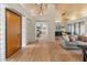 Expansive living space with wood floors, high ceilings, and a seamless flow throughout the home at 23240 N Country Club Trl, Scottsdale, AZ 85255