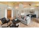 Bright, open living room features wood ceiling, light floors, sleek furniture, and stylish pendant lighting at 23240 N Country Club Trl, Scottsdale, AZ 85255