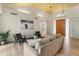Comfortable living room boasts wooden ceiling, light floors, modern furniture, and accent artwork at 23240 N Country Club Trl, Scottsdale, AZ 85255