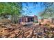 Expansive backyard with mature trees, desert landscaping, and covered patio area, offering a serene outdoor retreat at 2545 N 14Th St, Phoenix, AZ 85006