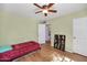 Comfortable bedroom featuring light-green walls, wood floors, and closet space at 2545 N 14Th St, Phoenix, AZ 85006