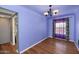 This dining room features hardwood floors, an elegant chandelier, and soft natural lighting at 2545 N 14Th St, Phoenix, AZ 85006