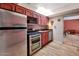Efficient kitchen with stainless steel appliances and natural wood cabinets offers functional style and easy access at 2545 N 14Th St, Phoenix, AZ 85006