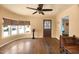 A bright living room features hardwood floors, neutral walls, and ample natural light from bay windows at 2545 N 14Th St, Phoenix, AZ 85006