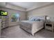 Comfortable bedroom with natural light, light grey furnishings, and a window with shutters at 25609 N Forest Rd # 13, Rio Verde, AZ 85263