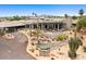Exterior of the Rio Verde Country Club features desert landscaping and a covered patio at 25609 N Forest Rd # 13, Rio Verde, AZ 85263