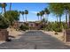 Desert home featuring a private drive, arched windows, and desert landscaping at 25609 N Forest Rd # 13, Rio Verde, AZ 85263