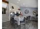 Open kitchen with stainless steel appliances, large center island, and grey-toned flooring at 25609 N Forest Rd # 13, Rio Verde, AZ 85263