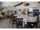 Open kitchen featuring a large island with bar seating, modern appliances, and grey-toned flooring at 25609 N Forest Rd # 13, Rio Verde, AZ 85263