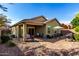 Spacious backyard with patio, barbecue grill, desert landscaping, and brick pavers at 2597 E Hickory St, Gilbert, AZ 85298
