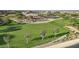 Aerial view of a beautiful community park with green grass and mature landscaping and playground at 2597 E Hickory St, Gilbert, AZ 85298