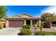 Charming single-story home with a two-car garage and well-manicured landscaping in a suburban neighborhood at 2597 E Hickory St, Gilbert, AZ 85298