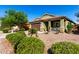 Well-maintained single-Gathering home features a neat yard, desert landscaping, and a two-car garage at 2597 E Hickory St, Gilbert, AZ 85298