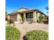 Charming single-story home with desert landscaping, covered porch, and beautiful stone accents at 2597 E Hickory St, Gilbert, AZ 85298