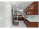 Stylish kitchen with stainless steel appliances, generous counter space, and rich wood cabinetry at 2597 E Hickory St, Gilbert, AZ 85298