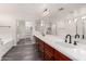 Bright bathroom featuring double sinks, spacious countertops, and modern fixtures at 26956 N 83Rd Gln, Peoria, AZ 85383