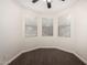 Carpeted bedroom featuring three large windows at 26956 N 83Rd Gln, Peoria, AZ 85383