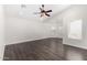 Bonus room with wood floors, recessed lights, a ceiling fan, and bright windows at 26956 N 83Rd Gln, Peoria, AZ 85383