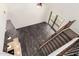 Open foyer with wood floors, stairs, and ample natural light from the glass patio doors at 26956 N 83Rd Gln, Peoria, AZ 85383