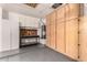 Functional garage space includes custom cabinets and a workbench at 26956 N 83Rd Gln, Peoria, AZ 85383