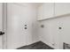 A practical mudroom area includes built-in storage cabinets and access to the backyard at 26956 N 83Rd Gln, Peoria, AZ 85383