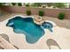 Aerial view of a private backyard pool and spa area with lush landscaping at 26956 N 83Rd Gln, Peoria, AZ 85383