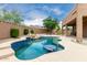 Inviting in-ground pool with spa, rock waterfall and tanning deck for leisure at 26956 N 83Rd Gln, Peoria, AZ 85383