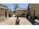 Backyard features a decorative fire pit, flagstone patio, and mature landscaping at 28093 N Pasture Canyon Dr, San Tan Valley, AZ 85143
