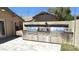Backyard featuring a built-in BBQ grill area with stone finishes and stainless steel appliances at 28093 N Pasture Canyon Dr, San Tan Valley, AZ 85143