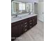 Modern bathroom features a double sink vanity with sleek hardware and contemporary mirrors for a spa-like experience at 28093 N Pasture Canyon Dr, San Tan Valley, AZ 85143