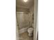 Cozy bathroom featuring a shower-over-tub with glass doors and updated fixtures at 28093 N Pasture Canyon Dr, San Tan Valley, AZ 85143