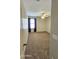 Bedroom features a window with blue curtains, a ceiling fan, and plush carpeting at 28093 N Pasture Canyon Dr, San Tan Valley, AZ 85143