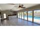 Bright bonus room with tiled floors, ceiling fan, and sliding glass doors leading to the pool area at 28093 N Pasture Canyon Dr, San Tan Valley, AZ 85143