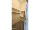 Walk-in closet with carpet and built-in shelving for maximum storage and organization at 28093 N Pasture Canyon Dr, San Tan Valley, AZ 85143