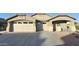 Charming single-story home featuring a three-car garage, manicured lawn, and neutral color palette at 28093 N Pasture Canyon Dr, San Tan Valley, AZ 85143