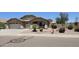 Charming home with a two-car garage and desert-landscaped front yard at 28093 N Pasture Canyon Dr, San Tan Valley, AZ 85143