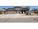Well-maintained home featuring a two-car garage, desert landscaping, and a welcoming entryway at 28093 N Pasture Canyon Dr, San Tan Valley, AZ 85143