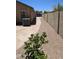 House exterior features a gravel path with a wall that enhances its curb appeal and privacy at 28093 N Pasture Canyon Dr, San Tan Valley, AZ 85143