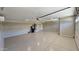 The garage features bright lighting, a smooth painted floor, and modern amenities at 28093 N Pasture Canyon Dr, San Tan Valley, AZ 85143