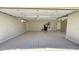 A bright garage with a clean epoxy floor, space for storage and parking at 28093 N Pasture Canyon Dr, San Tan Valley, AZ 85143