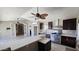 Updated kitchen with stainless appliances, island seating, and generous counter space, perfect for cooking and entertaining at 28093 N Pasture Canyon Dr, San Tan Valley, AZ 85143